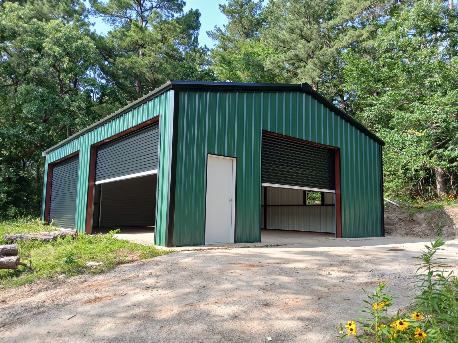 Fully enclosed metal garage in green finish